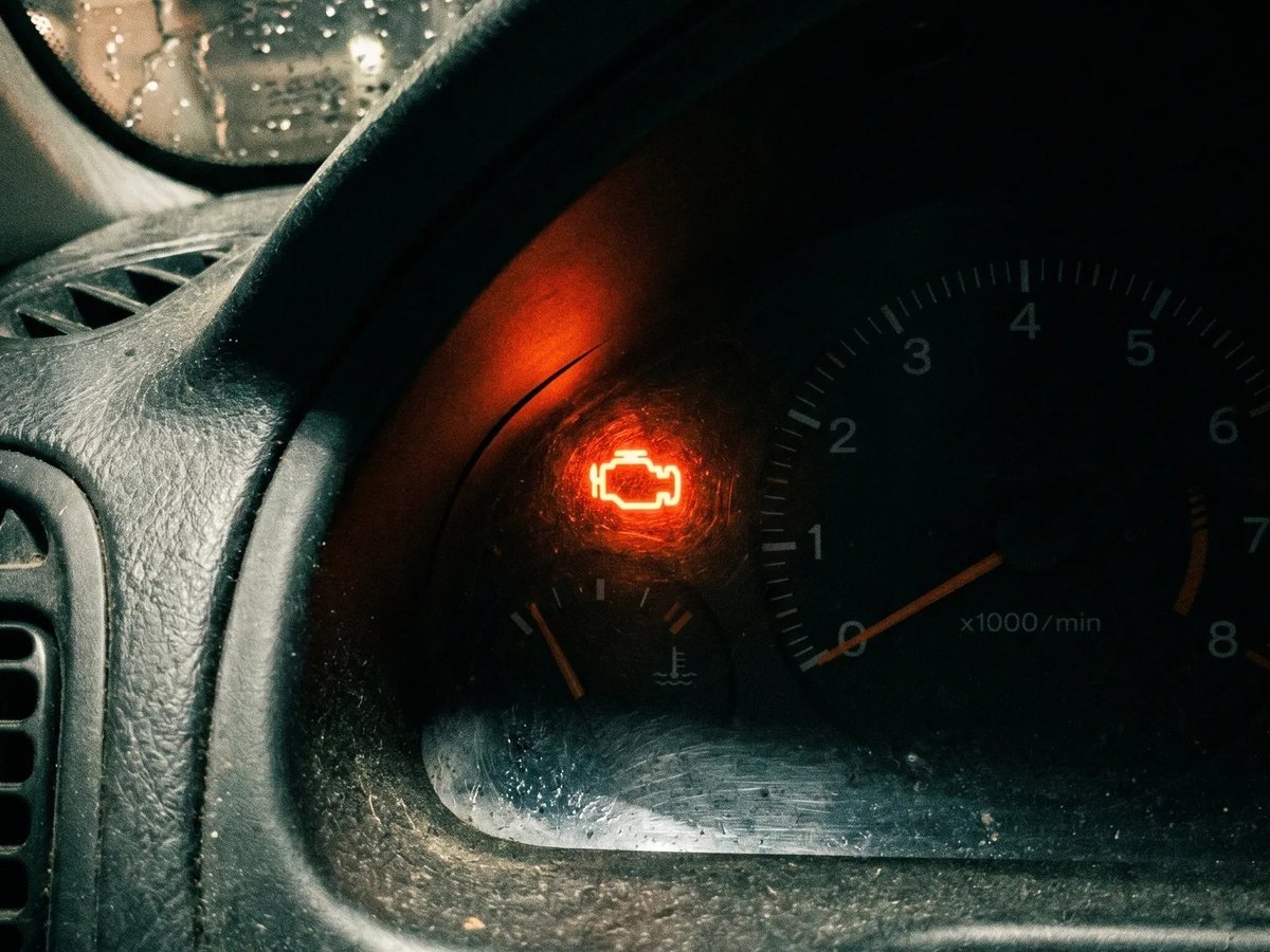 Check engine light lit on a car dashboard