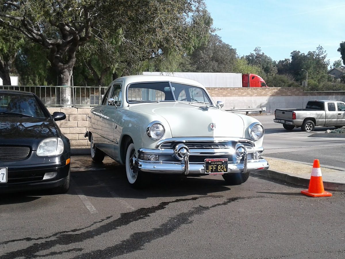 A customer's classic Ford parked outside Cal Tire & Auto Repair