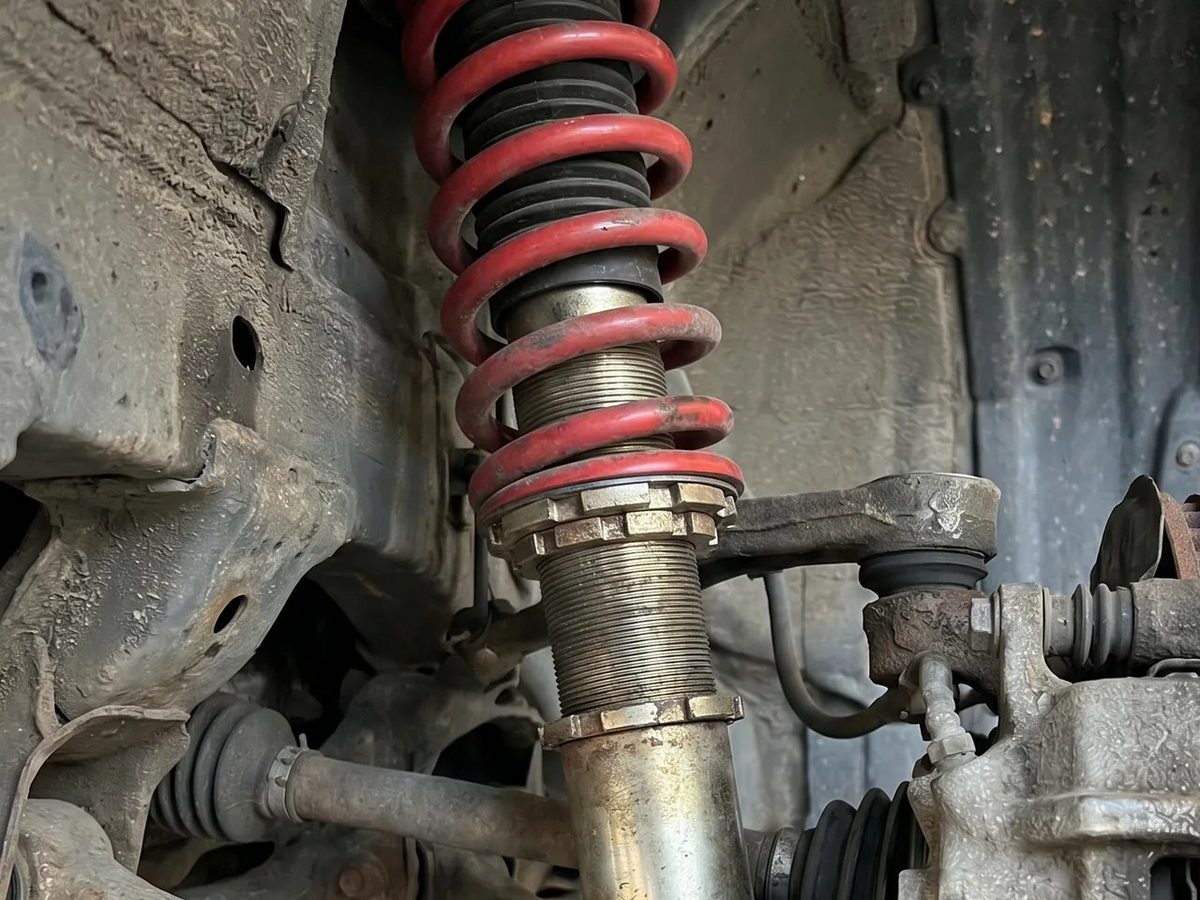 Coil-over spring and strut on a lifted car